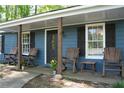 Welcoming front porch with rocking chairs and decorative touches, creating a comfortable entryway at 4120 Highway 92, Acworth, GA 30102