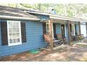 Cozy front porch with rocking chairs, perfect for enjoying the outdoors and relaxing at 4120 Highway 92, Acworth, GA 30102