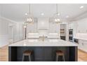 Spacious kitchen showcasing a large island, stainless steel appliances and pendant lighting at 325 Mont Harmony Sw Rd, Powder Springs, GA 30127
