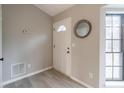 Bright and airy entryway with a white door and wood-look flooring at 3814 Whaley Ct, Snellville, GA 30039