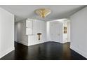 Bright entryway with dark hardwood floors and built-in shelving at 750 Park Ne Ave # 13W, Atlanta, GA 30326