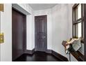 Residential hallway with elevator access and dark hardwood floors at 750 Park Ne Ave # 13W, Atlanta, GA 30326
