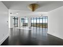 Spacious living room with dark hardwood floors and floor to ceiling windows at 750 Park Ne Ave # 13W, Atlanta, GA 30326