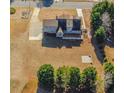 Expansive aerial view of gray home with a deck overlooking the backyard and partial driveway at 1019 Walnut Creek Dr, Woodstock, GA 30188