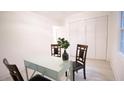 Bright dining area with table, chairs, and view of storage in neutral color tones provides a cozy eating space at 4001 Red Oak Dr, Atlanta, GA 30340