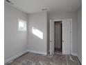 Bright bedroom with neutral walls and closet at 1975 Sage Lake Bend Sw, Marietta, GA 30064