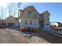 Two-story house under construction, featuring a charming farmhouse style and large windows at 1975 Sage Lake Bend Sw, Marietta, GA 30064