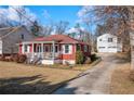 View of the house showing the long driveway and detached garage at 318 Stewart Nw Ave, Marietta, GA 30064