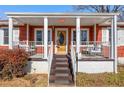 Inviting front porch with steps leading to the entrance of the home at 318 Stewart Nw Ave, Marietta, GA 30064