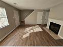 Open living area with fireplace and new wood flooring at 926 Westland Dr, Marietta, GA 30064