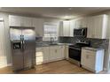 Modern kitchen with stainless steel appliances and granite countertops at 5380 Saint Lo Ln, Atlanta, GA 30349