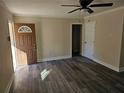 Bright and airy living room with new flooring and neutral color scheme at 5312 Westford Cir, Atlanta, GA 30349