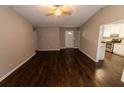 Living room with hardwood floors, high ceilings, and an open concept design at 945 Navajo Trl, Covington, GA 30016