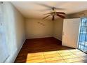 Bright bedroom featuring hardwood floors and a door to exterior at 880 Cascade Sw Rd, Atlanta, GA 30311