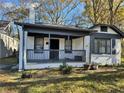 Renovated bungalow with a front porch and well-manicured lawn at 880 Cascade Sw Rd, Atlanta, GA 30311