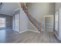 Bright living room featuring new floors, fresh paint, wooden staircase and natural light at 3634 Autumn Ridge Pkwy, Marietta, GA 30066