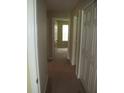 Neutral-colored hallway with linen closet and open view to a sunlit room at 959 Romer Pl, Stone Mountain, GA 30083