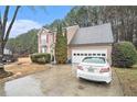 A two-story home with a two-car garage and well-maintained landscaping at 113 Ambridge Ct, Lawrenceville, GA 30044