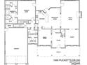 A detailed first floor plan displaying the kitchen, living spaces, and garage at 1949 Pucketts Sw Dr, Lilburn, GA 30047