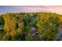 Stunning aerial view captures a charming home nestled amidst a green forest landscape at 3293 Valleydale Sw Dr, Atlanta, GA 30311