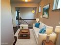Bright living room featuring a modern white sofa, stylish decor, and an inviting atmosphere at 1957 Paxton Sw Dr, Lilburn, GA 30047