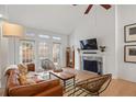 Comfortable living room boasts a fireplace, TV, and access to a private backyard at 1827 Rockridge Pl, Atlanta, GA 30324