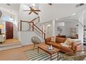 Inviting living room showcasing a staircase, modern decor, and plenty of natural light at 1827 Rockridge Pl, Atlanta, GA 30324