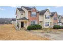 Charming townhouse featuring a mix of brick and vinyl siding and well-maintained front yard at 1450 Riverrock Trl, Riverdale, GA 30296