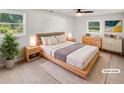 Cozy bedroom features two windows, neutral decor, and contemporary furniture at 30 N Cleveland Church Rd, Mcdonough, GA 30253
