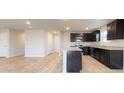 Spacious kitchen boasts dark cabinets, granite counters, and stainless steel appliances at 631 Egrets Lot 50 Lndg, Covington, GA 30014