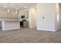 Spacious open-concept kitchen with granite countertops and stainless steel appliances at 631 Egrets Lot 50 Lndg, Covington, GA 30014