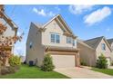 Charming two-story home with a two-car garage, lawn and landscaped front yard at 3372 Baylor Cir, Mcdonough, GA 30253