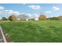 House with expansive green space and distant trees at 3825 Green Ave, Loganville, GA 30052