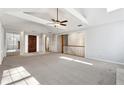 Open living room with high ceilings and neutral color palette at 3562 Ontario Ct, Buford, GA 30519