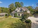 Inviting home with lush landscaping, a neatly kept lawn, and an elegant facade at 3420 Aviary Ln, Acworth, GA 30101
