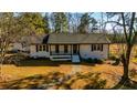 Charming one-story home featuring a cozy front porch and well-maintained landscaping at 3625 Pointer Rd, Loganville, GA 30052