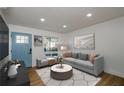 Cozy living room with hardwood floors, modern furnishings, and plenty of natural light at 474 Fairlock Nw Ln, Atlanta, GA 30331