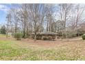 Ranch house nestled among trees on a lot with grassy areas at 4485 Canary Ct, Lithia Springs, GA 30122