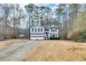 Split level home with a 2-car garage and a long driveway at 336 Adelene Way, Dallas, GA 30157