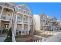 Stylish two-story home with a welcoming porch, white picket fence and manicured lawn at 646 Brashy St, Woodstock, GA 30188