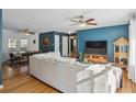 Open concept living room with hardwood floors, ceiling fan, and comfortable seating area at 1522 Waltham Se Pl, Atlanta, GA 30316