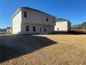 Spacious backyard with new sod and a view of neighboring homes at 333 Orwell Dr, Social Circle, GA 30025