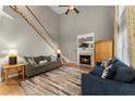Spacious living room features hardwood floors, a fireplace, and ample natural light at 2352 Kelman Pl, Dacula, GA 30019