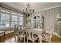 Elegant dining room with hardwood floors, a chandelier, and large windows at 5341 Hill Nw Rd, Acworth, GA 30101