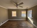 Bright bedroom featuring hardwood floors and multiple windows at 1264 Hartford Sw Ave, Atlanta, GA 30310