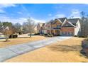 Two-story house with a long driveway and mature trees at 1251 Irwin Lake Way, Marietta, GA 30064