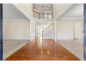 Two-story foyer with hardwood floors and a staircase at 1251 Irwin Lake Way, Marietta, GA 30064