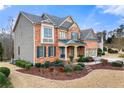 Side view of a two-story house with gray siding and brick accents at 1251 Irwin Lake Way, Marietta, GA 30064