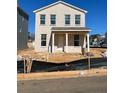 Two story home with brick facade and covered porch, situated in a new development at 500 Aberdeen Meadow Ln, Acworth, GA 30102