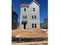 Attractive three-story home featuring light grey siding and a brick foundation at 504 Aberdeen Meadow Ln, Acworth, GA 30102